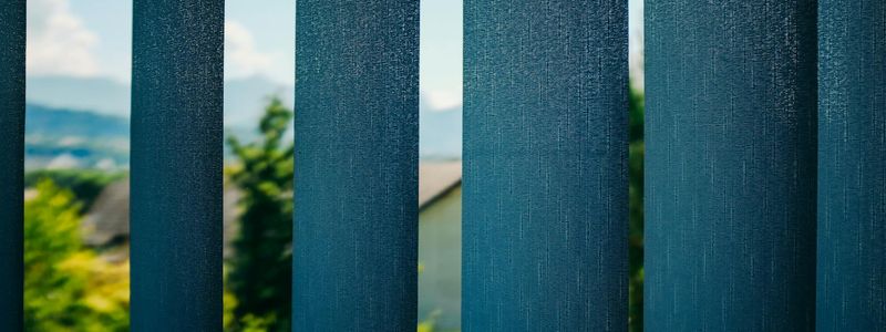 Sunlight streaming through blinds into a peaceful room.